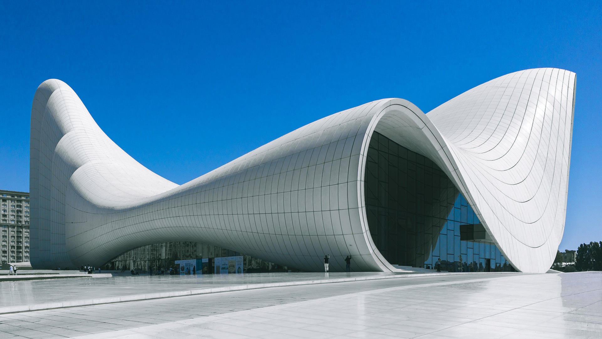 Heydar Aliyev Cultural Centre; with curved design against a clear blue sky